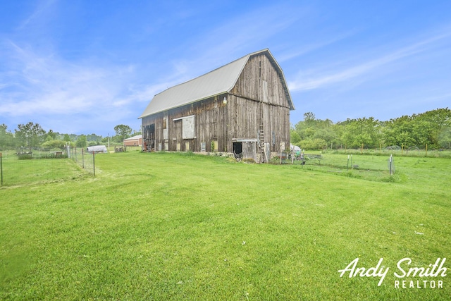 9386 N Vandecar Rd, Farwell, MI 48622 - view of yard featuring a barn and an outdoor structure
