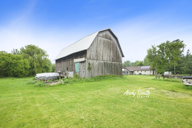 9386 N Vandecar Rd, Farwell, MI 48622 - view of barn with a yard