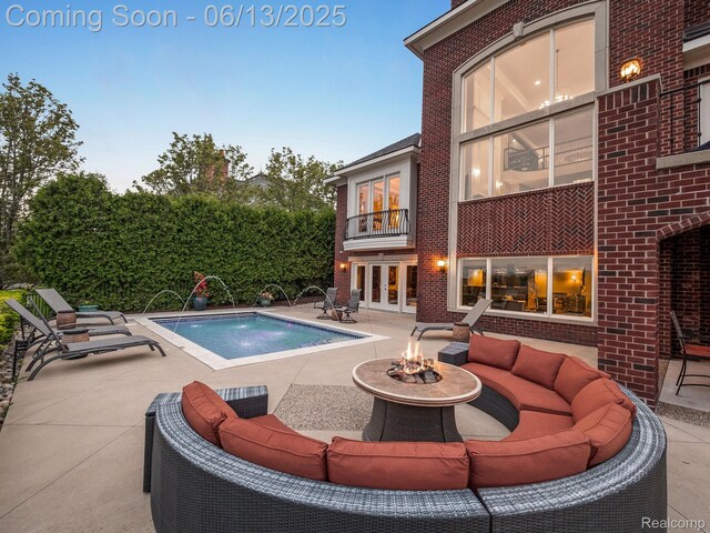 2750 Turtle Bluff Dr, Bloomfield Hills, MI 48302 - swimming pool with a patio, french doors, and an outdoor living space with a fire pit