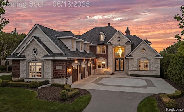 2750 Turtle Bluff Dr, Bloomfield Hills, MI 48302 - french provincial home featuring stone siding, french doors, a chimney, and concrete driveway
