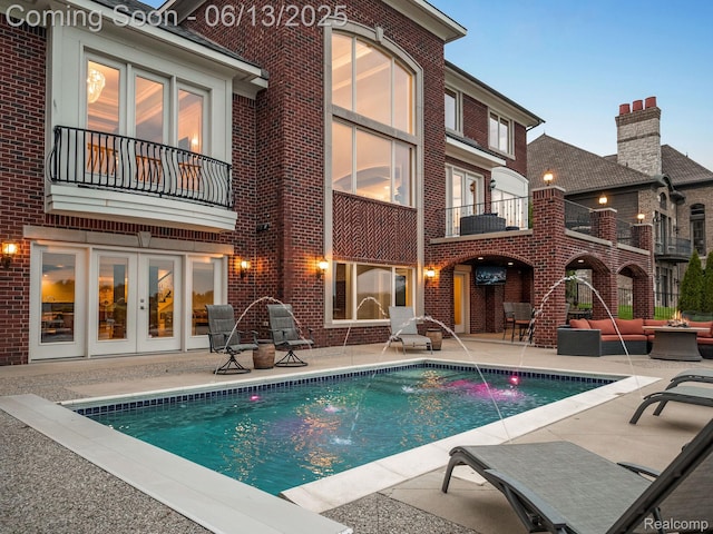 2750 Turtle Bluff Dr, Bloomfield Hills, MI 48302 - back of property featuring a balcony, a patio, brick siding, and french doors