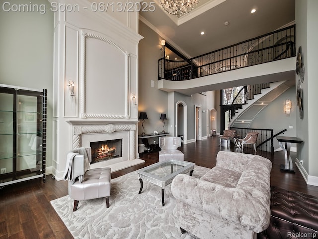 2750 Turtle Bluff Dr, Bloomfield Hills, MI 48302 - living area featuring ornamental molding, stairway, wood finished floors, arched walkways, and a high ceiling