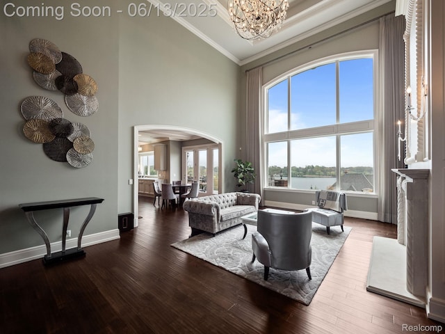 2750 Turtle Bluff Dr, Bloomfield Hills, MI 48302 - living area with arched walkways, high vaulted ceiling, a chandelier, crown molding, and wood finished floors