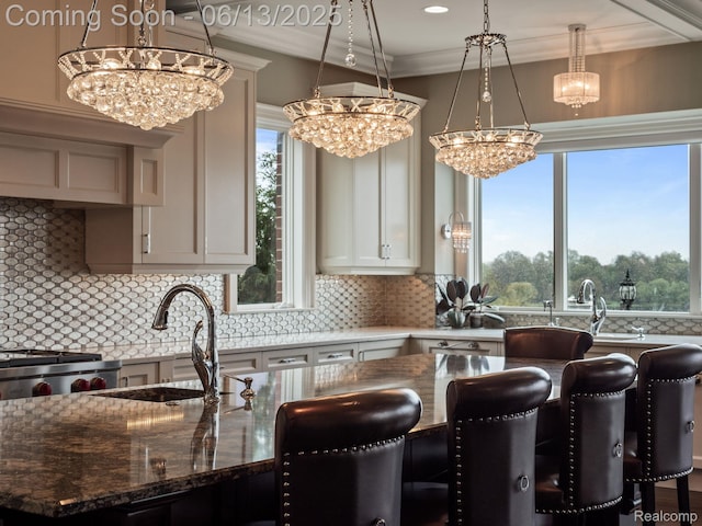 2750 Turtle Bluff Dr, Bloomfield Hills, MI 48302 - kitchen featuring a chandelier, a kitchen breakfast bar, tasteful backsplash, hanging light fixtures, and dark stone countertops