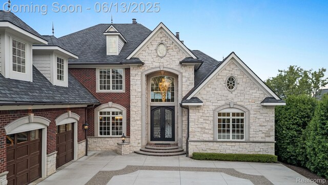 2750 Turtle Bluff Dr, Bloomfield Hills, MI 48302 - french country inspired facade with stone siding and roof with shingles