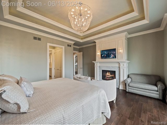2750 Turtle Bluff Dr, Bloomfield Hills, MI 48302 - bedroom with a tray ceiling, a chandelier, dark wood finished floors, a premium fireplace, and crown molding
