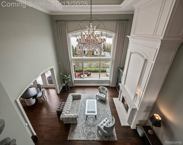 2750 Turtle Bluff Dr, Bloomfield Hills, MI 48302 - living room with dark wood-style floors, ornamental molding, a chandelier, and arched walkways
