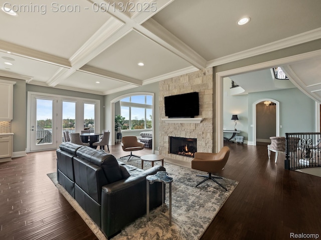 2750 Turtle Bluff Dr, Bloomfield Hills, MI 48302 - living room featuring arched walkways, crown molding, a fireplace, beam ceiling, and wood finished floors