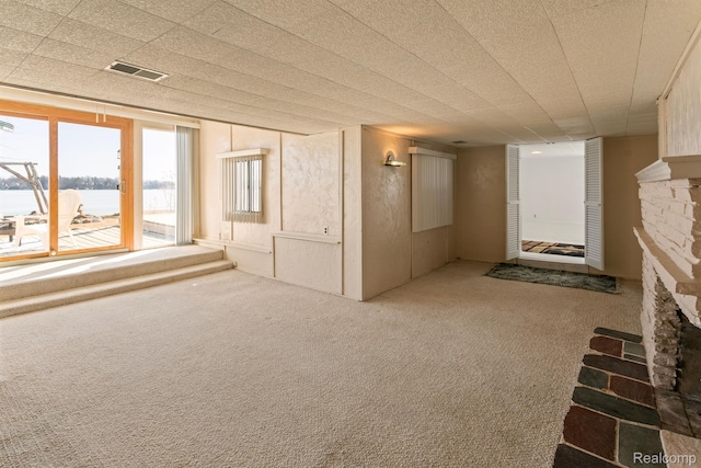 2830 N Duck Lake Rd, Highland, MI 48356 - carpeted spare room featuring a water view