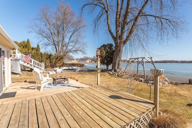 2830 N Duck Lake Rd, Highland, MI 48356 - wooden terrace with a water view and stairway