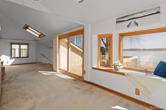 2830 N Duck Lake Rd, Highland, MI 48356 - unfurnished sunroom featuring a water view and lofted ceiling