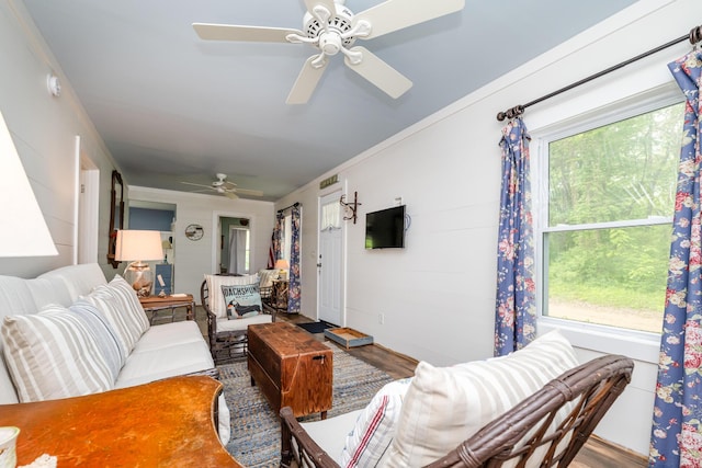 3619 Dearborn St, Coloma, MI 49038 - living area with a ceiling fan, wood finished floors, and ornamental molding