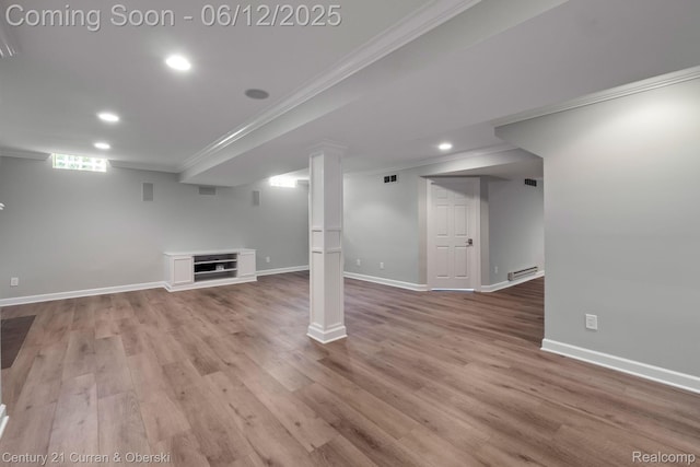 44251 Deep Hollow Cir, Northville, MI 48168 - below grade area featuring ornamental molding, recessed lighting, wood finished floors, a baseboard heating unit, and baseboards