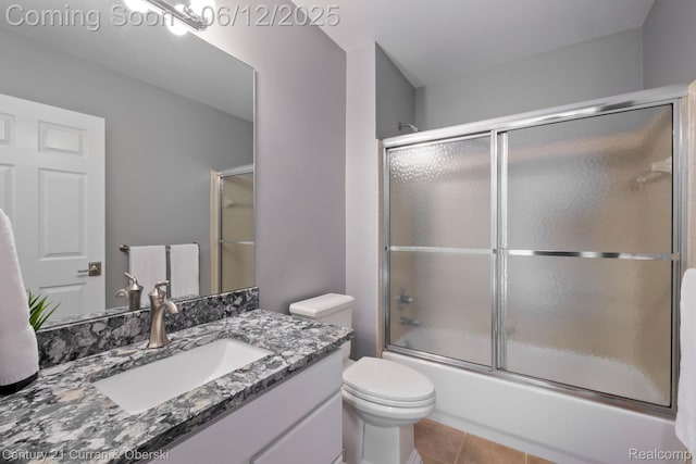 44251 Deep Hollow Cir, Northville, MI 48168 - full bathroom featuring vanity, shower / bath combination with glass door, toilet, and tile patterned floors