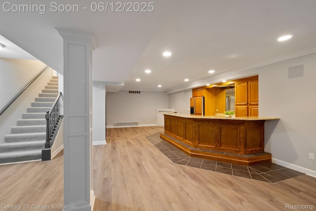 44251 Deep Hollow Cir, Northville, MI 48168 - indoor bar with recessed lighting, paneled refrigerator, baseboard heating, light wood-style floors, and baseboards