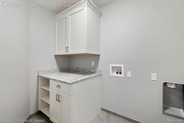 44251 Deep Hollow Cir, Northville, MI 48168 - laundry room featuring cabinet space, hookup for a washing machine, baseboards, and light tile patterned floors