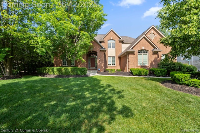 44251 Deep Hollow Cir, Northville, MI 48168 - view of front of house featuring brick siding and a front lawn
