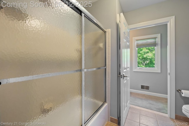 44251 Deep Hollow Cir, Northville, MI 48168 - full bathroom featuring toilet, tile patterned floors, enclosed tub / shower combo, and baseboards