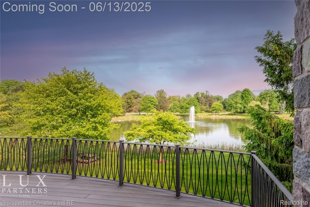 2937 Turtle Pond Ct, Bloomfield Hills, MI 48302 - deck at dusk featuring a water view