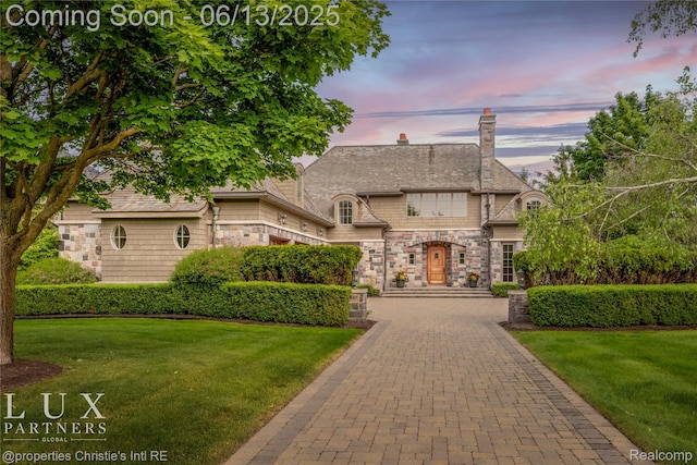 2937 Turtle Pond Ct, Bloomfield Hills, MI 48302 - french country style house featuring stone siding, a lawn, and a chimney