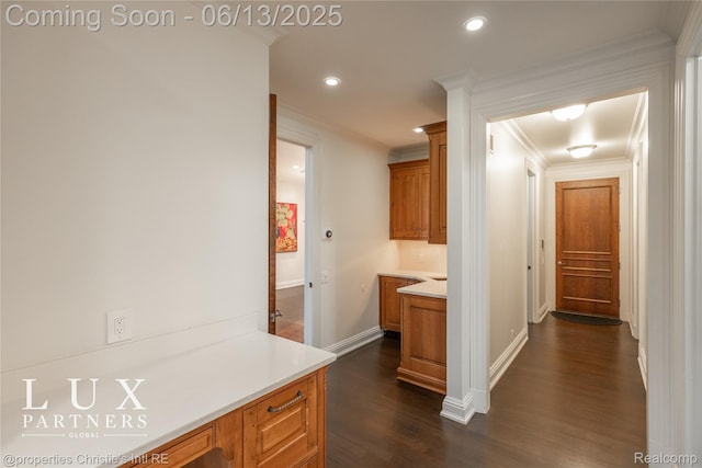 2937 Turtle Pond Ct, Bloomfield Hills, MI 48302 - kitchen featuring dark wood-style floors, ornamental molding, brown cabinetry, light countertops, and recessed lighting