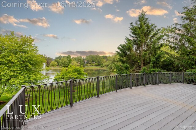 2937 Turtle Pond Ct, Bloomfield Hills, MI 48302 - deck at dusk featuring a water view and view of wooded area