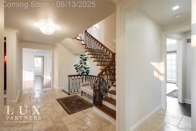 2937 Turtle Pond Ct, Bloomfield Hills, MI 48302 - stairway featuring stone tile floors and a chandelier