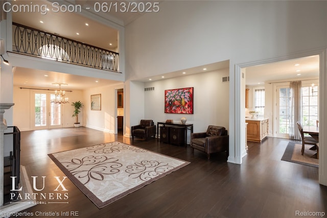 2937 Turtle Pond Ct, Bloomfield Hills, MI 48302 - living room featuring a towering ceiling, a chandelier, dark wood-style floors, and recessed lighting
