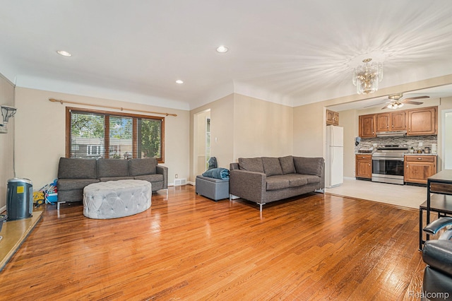 30060 Eastfield St, Farmington Hills, MI 48334 - living room featuring light wood-style floors, a chandelier, recessed lighting, and ceiling fan