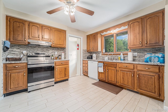 30060 Eastfield St, Farmington Hills, MI 48334 - kitchen with stainless steel electric range, dishwasher, under cabinet range hood, brown cabinetry, and a ceiling fan