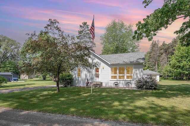 3077 Edson St, Coleman, MI 48618 - view of front facade featuring a front yard and roof with shingles
