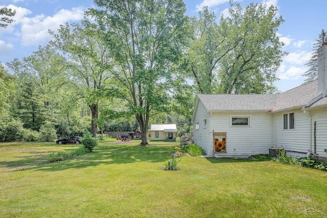 3077 Edson St, Coleman, MI 48618 - view of green lawn with central air condition unit