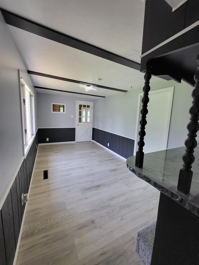 1010 S Pearce St, Owosso, MI 48867 - unfurnished living room with wainscoting and wood finished floors