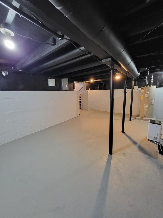 1010 S Pearce St, Owosso, MI 48867 - unfinished basement with water heater