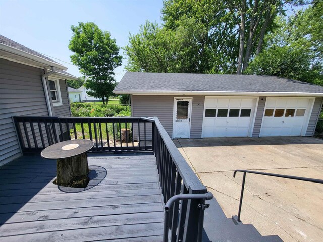 1010 S Pearce St, Owosso, MI 48867 - wooden deck with a garage and an outdoor structure