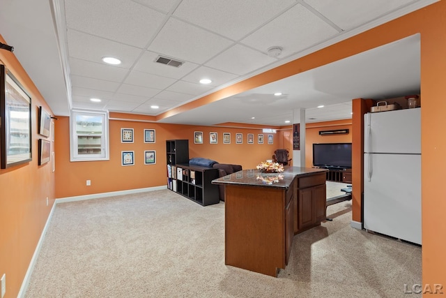 1377 Maplewood Dr St, Saline, MI 48176 - kitchen featuring freestanding refrigerator, dark countertops, a center island, light carpet, and open floor plan