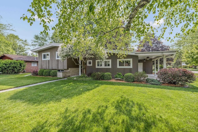 1449 Sauk Ln, Saginaw, MI 48638 - view of front facade with a front lawn and a ceiling fan