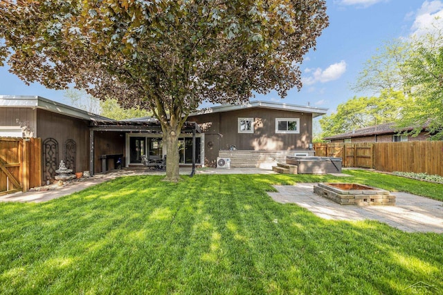 1449 Sauk Ln, Saginaw, MI 48638 - back of property featuring a patio area and a fenced backyard