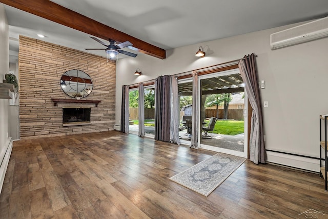 1449 Sauk Ln, Saginaw, MI 48638 - unfurnished living room with a wall mounted AC, ceiling fan, a stone fireplace, beamed ceiling, and wood finished floors