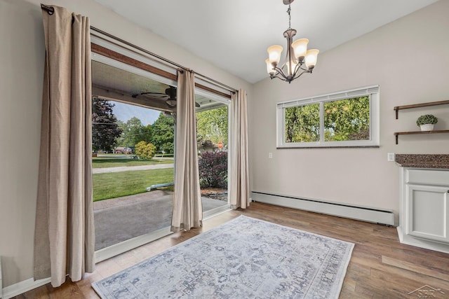 1449 Sauk Ln, Saginaw, MI 48638 - unfurnished dining area with baseboard heating, a chandelier, and wood finished floors