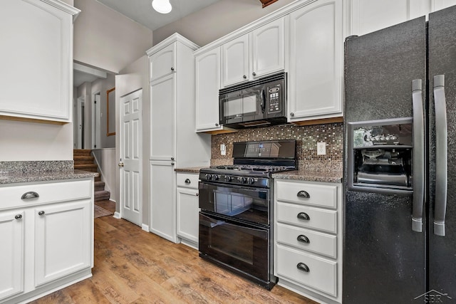 1449 Sauk Ln, Saginaw, MI 48638 - kitchen featuring black appliances, white cabinetry, light wood-style flooring, and tasteful backsplash