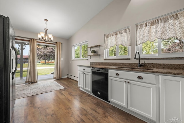 1449 Sauk Ln, Saginaw, MI 48638 - kitchen with black appliances, lofted ceiling, a chandelier, dark wood-style flooring, and a baseboard heating unit