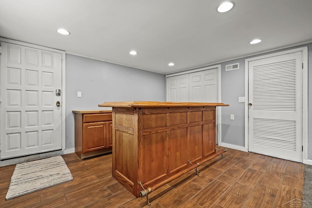 1449 Sauk Ln, Saginaw, MI 48638 - kitchen with dark wood-style floors, recessed lighting, brown cabinets, and light countertops