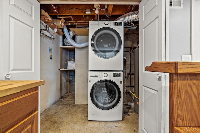 1449 Sauk Ln, Saginaw, MI 48638 - laundry room featuring estacked washer and dryer