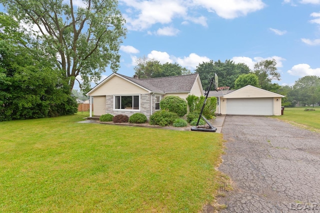 1104 Sunset Dr, Tecumseh, MI 49286 - single story home featuring a garage, stone siding, and a front lawn