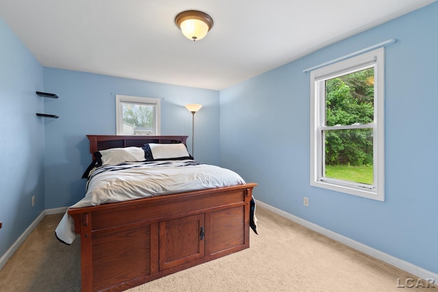 1104 Sunset Dr, Tecumseh, MI 49286 - bedroom featuring light carpet and baseboards