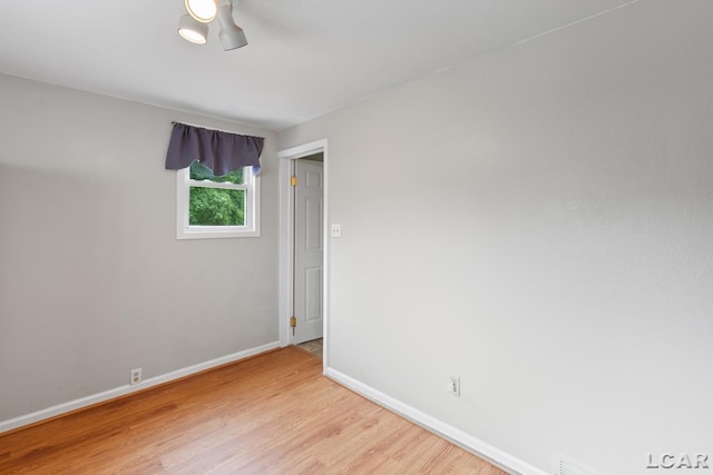 1104 Sunset Dr, Tecumseh, MI 49286 - spare room featuring light wood-style floors, baseboards, and ceiling fan
