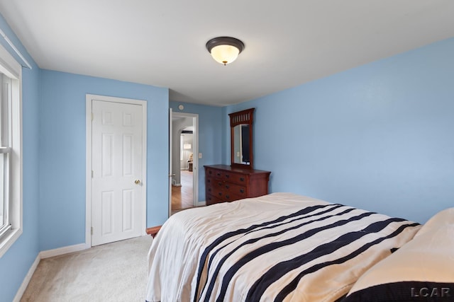 1104 Sunset Dr, Tecumseh, MI 49286 - carpeted bedroom with baseboards