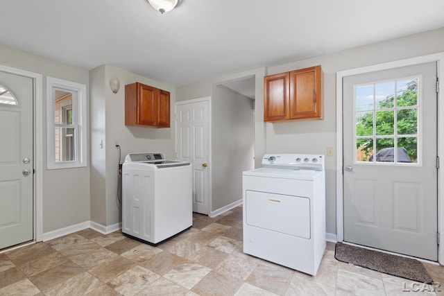 1104 Sunset Dr, Tecumseh, MI 49286 - washroom featuring cabinet space, separate washer and dryer, baseboards, and light stone finish floors