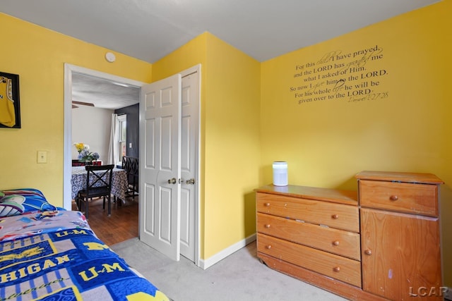 1104 Sunset Dr, Tecumseh, MI 49286 - bedroom featuring baseboards and light colored carpet
